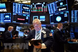 Giao dịch viên tại Sàn giao dịch chứng khoán New York, Mỹ. (Ảnh: AFP/TTXVN) 