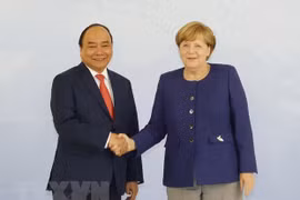 Thủ tướng Đức Angela Merkel và Thủ tướng Nguyễn Xuân Phúc. (Ảnh: Thống Nhất/TTXVN)