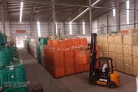 Chuẩn bị nguồn hàng gạo xuất khẩu tại nhà máy của Tập đoàn Lộc Trời (tỉnh An Giang). (Ảnh: Vũ Sinh/TTXVN)