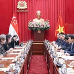 Đại tướng Lương Tam Quang, Bộ trưởng Bộ Công an hội đàm với Bộ trưởng Bộ Phát triển Kỹ thuật số và Thông tin Singapore Josephine Teo. (Ảnh: Phạm Kiên/TTXVN)