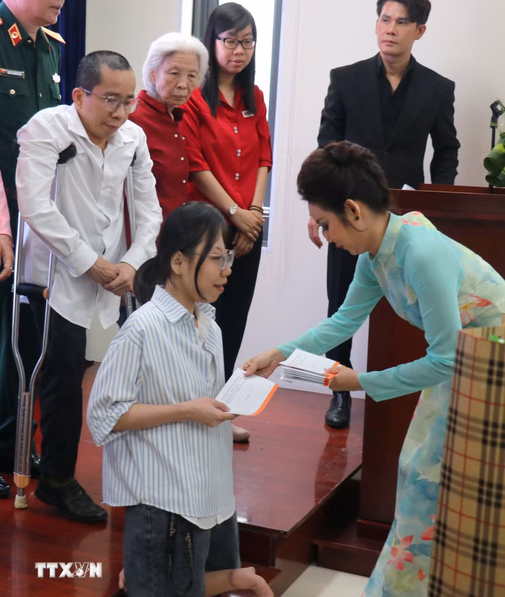 ttxvn-tp-ho-chi-minh-hop-mat-thong-tin-cac-hoat-dong-ky-niem-65-nam-tham-hoa-da-cam-o-viet-nam5.jpg