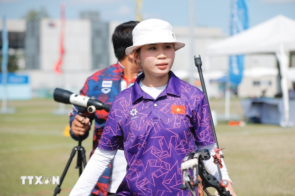 Vận động viên Lê Phạm Vân Anh hoàn thành phần thi trong trận chung kết. (Ảnh: Minh Quyết/TTXVN)