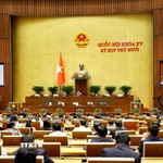 Bộ trưởng Bộ Công an Lương Tam Quang, thừa ủy quyền của Thủ tướng Chính phủ trình bày Báo cáo công tác phòng, chống tội phạm và vi phạm pháp luật năm 2025. (Ảnh: Doãn Tấn/TTXVN)