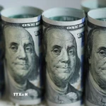 Đồng USD đã đồng loạt sụt giảm so với hầu hết các đồng tiền chủ chốt khác. (Ảnh: THX/TTXVN)