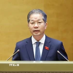 Chánh án Tòa án nhân dân tối cao Nguyễn Văn Quảng trình bày Báo cáo về việc thực hiện một số nghị quyết của Quốc hội nhiệm kỳ khóa XIV và khóa XV về giám sát chuyên đề, chất vấn. (Ảnh: Doãn Tấn/TTXVN)