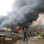 Hiện trường đám cháy tại làng Guryong, quận Gangnam, Hàn Quốc sáng 16/1/2026. (Ảnh: Yonhap/TTXVN)