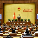 Quốc hội biểu quyết thông qua Luật Xây dựng (sửa đổi). (Ảnh: Doãn Tấn/TTXVN)