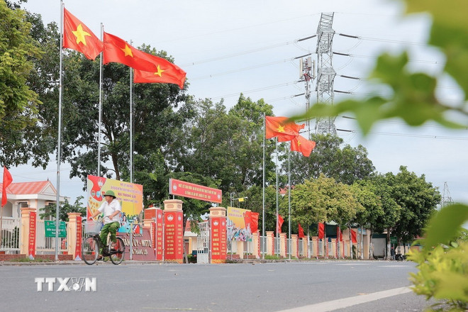 កម្មវិធីជនបទថ្មីនាំមកនូវរូបរាងថ្មីដល់ហេដ្ឋារចនាសម្ព័ន្ធដឹកជញ្ជូនជនបទរបស់ Thanh Hoa។ (រូបថត៖ Le Dong/VNA) ttxvn-nong-thon-moi-thanh-hoa.jpg
