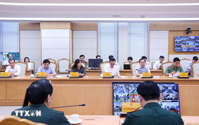 Các bộ ngành, địa phương dự họp về ứng phó cơn bão Matmo. (Ảnh: Văn Điệp/TTXVN) ttxvn-pho-thu-tuong-tran-hong-ha-hop-ung-pho-con-bao-matmo2.jpg