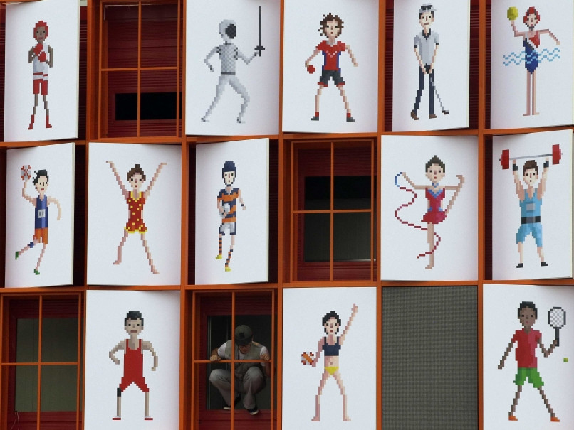 Bức tường bên ngoài làng vận động viên Asiad. (Ảnh: AFP)