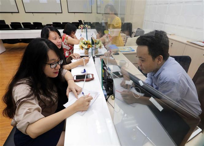 Chứng khoán Việt Nam mở phiên ngập sắc đỏ sau khi Fed tăng lãi suất ảnh 1