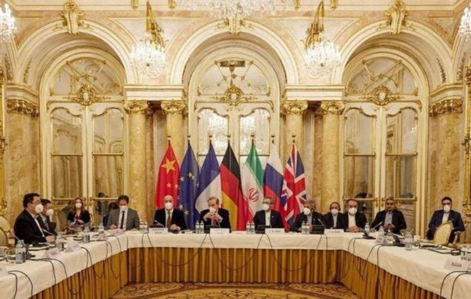 Toàn cảnh vòng đàm phán hạt nhân giữa đại diện Iran với nhóm P4+1 (Anh, Pháp, Nga, Trung Quốc cùng Đức) tại Vienna, Áo. (Ảnh: IRNA/TTXVN) Iran: Không còn quá nhiều khác biệt trong đàm phán hạt nhân tại Vienna ảnh 1