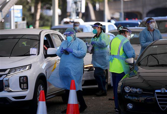 Dịch bệnh COVID-19 tiếp tục diễn biến phức tạp tại Australia và Ấn Độ ảnh 1