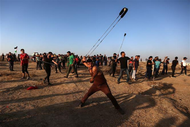 Đụng độ với binh sĩ Israel làm 12 người Palestine thương vong ảnh 1