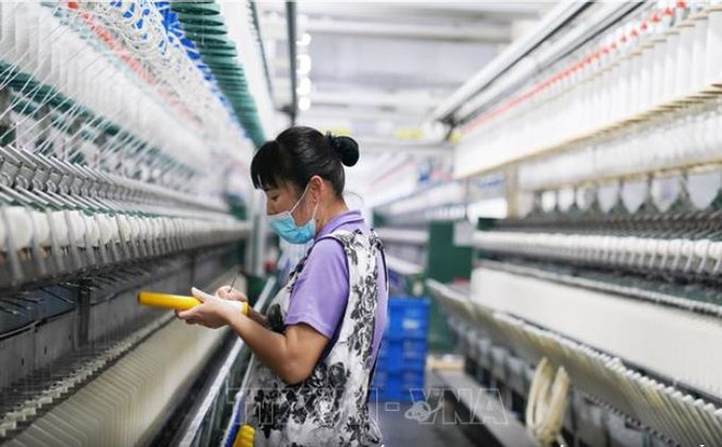 Đà tăng trưởng kinh tế của Trung Quốc giảm tốc mạnh trong quý 2 ảnh 1