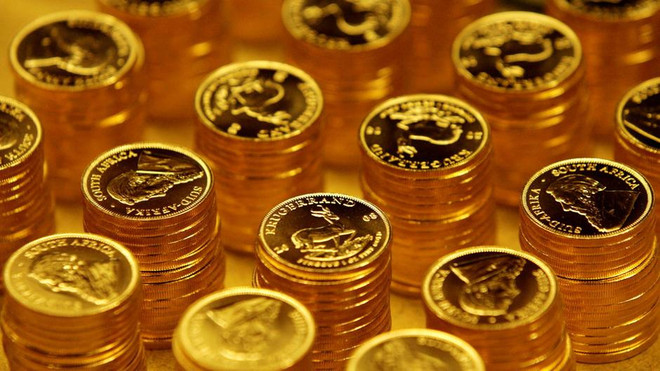 Ảnh minh họa. (Nguồn: Reuters) Giá vàng thế giới đi xuống, còn gần 1.856 USD một ounce ảnh 1