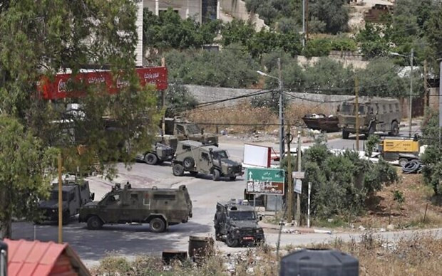 Lực lượng an ninh Israel hoạt động ở thành phố Jenin, Bờ Tây. (Nguồn: AFP) 2 người Palestine tử vong trong chiến dịch quân sự của Israel ở Bờ Tây ảnh 1