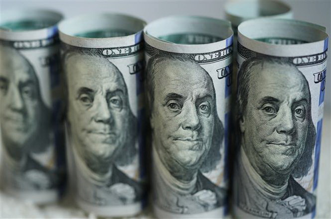 Đồng USD. (Ảnh: THX/TTXVN) Cuba dỡ bỏ mức thuế 10% với đồng USD nhằm thúc đẩy nền kinh tế ảnh 1