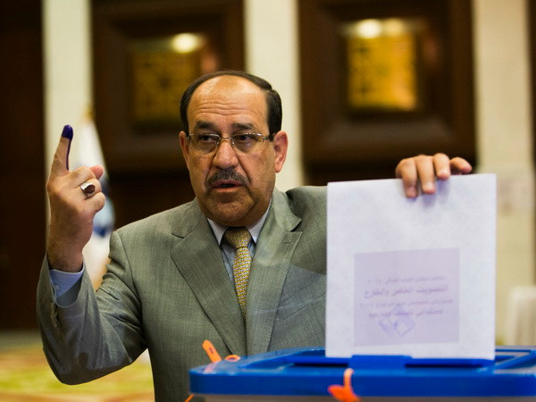 Thủ tướng Iraq Nouri al-Maliki bỏ phiếu tại điểm bầu cử ở thủ đô Baghdad ngày 30/4. (Ảnh: THX/TTXVN) Bầu cử Quốc hội Iraq: Liên minh của Thủ tướng Maliki thắng cử ảnh 1