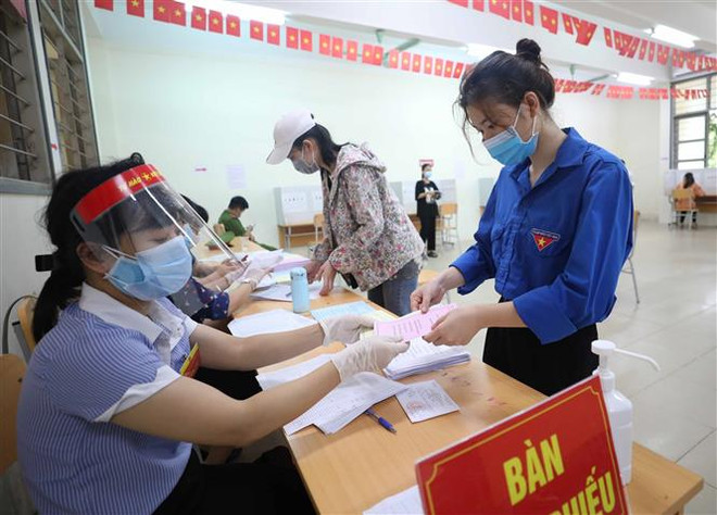 Cử tri Việt Nam đi bầu cử trong điều kiện bảo đảm an toàn phòng dịch ảnh 1