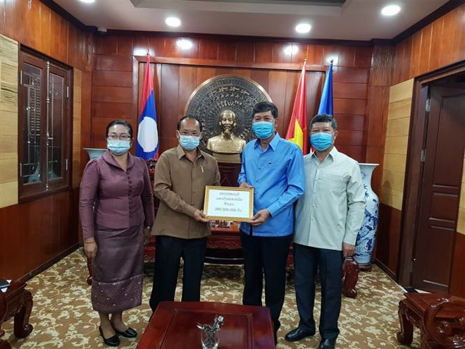 Lào chung sức cùng Việt Nam trong cuộc chiến chống dịch COVID-19 ảnh 2