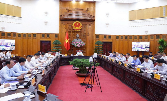 Thủ tướng Phạm Minh Chính chủ trì họp thúc đẩy tiến độ triển khai dự án đường dây 500kv mạch 3 và cung ứng điện tháng cao điểm. (Ảnh: Dương Giang/TTXVN) ttxvn-du_an_duong_day_500kv2.jpg
