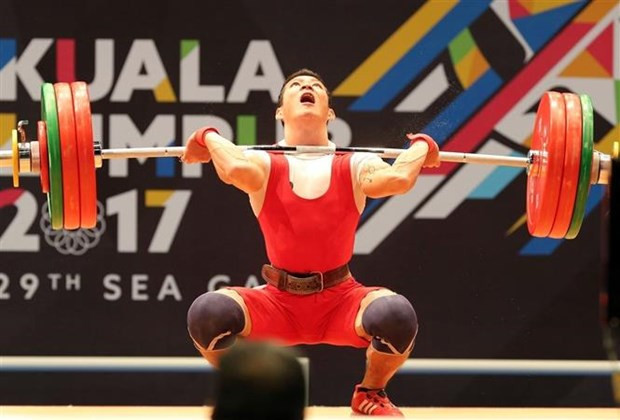 Vận động viên cử tạ Thạch Kim Tuấn tại SEA Games 29 ở Malaysia, tháng 8/2017. (Ảnh: Quốc Khánh/TTXVN) Cử tạ được kỳ vọng mang về huy chương cho Đoàn thể thao Việt Nam ảnh 1