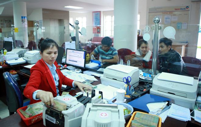 Xử lý nợ xấu, sở hữu chéo trong ngành ngân hàng được cải thiện ảnh 1