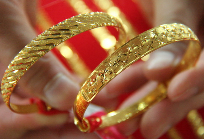 Giá vàng thế giới phục hồi từ mức thấp nhất trong hai tuần ảnh 1