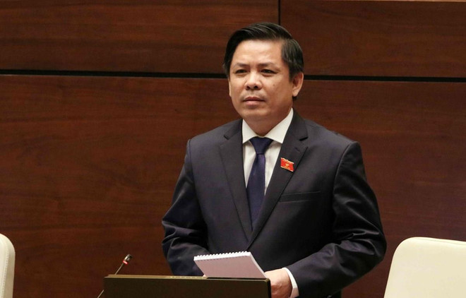 Bộ trưởng Bộ Giao thông Vận tải Nguyễn Văn Thể trong phiên chất vấn tại Quốc hội sáng 5/6. (Ảnh: TTXVN) Kỳ họp thứ 7, Quốc hội khóa XIV: Biến cam kết thành hành động ảnh 2