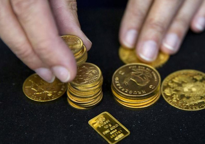 Giá vàng giao ngay tại châu Á giảm trong khi đồng USD yếu đi ảnh 1