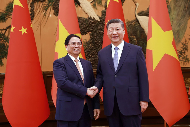 Thủ tướng Phạm Minh Chính hội kiến Tổng Bí thư, Chủ tịch Trung Quốc Tập Cận Bình. (Ảnh: Dương Giang/TTXVN) ttxvn-wef 3.jpg