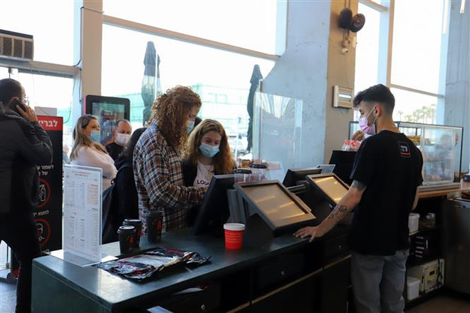 IMF đánh giá kinh tế toàn cầu đang hồi phục mạnh mẽ hơn ảnh 1