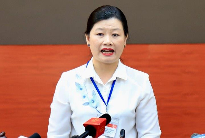 Bà Vương Thị Vân Khánh, Chánh Văn phòng Ủy ban nhân dân quận Thanh Xuân khẳng định phía Quận không yêu cầu phường Hạ Đình thu hồi văn bản khuyến cáo. (Ảnh: PV/Vietnam+) Vụ cháy Rạng Đông: Không có việc phá hoại do con người ảnh 2