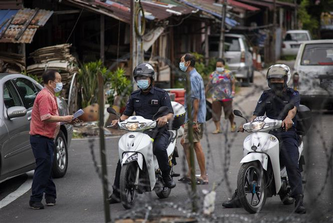 Malaysia xác lập 2 kỷ lục buồn trong ngày về dịch bệnh COVID-19 ảnh 1