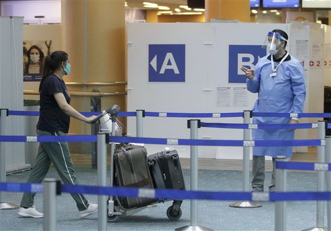 COVID-19: Chính phủ Canada ủng hộ khái niệm hộ chiếu vaccine ảnh 1