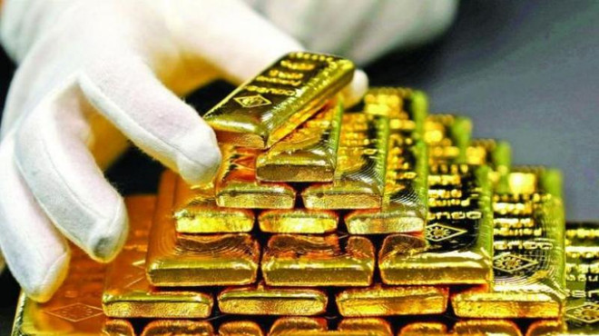 (Ảnh minh họa. Nguồn: AFP) Giá vàng châu Á tiếp tục đi xuống, rời khỏi ngưỡng 1.800 USD ảnh 1