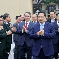 Thủ tướng Phạm Minh Chính đến dự Hội nghị toàn quốc tổng kết công tác Tư pháp năm 2025. (Ảnh: Dương Giang/TTXVN)