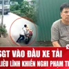 Tạm giữ hình sự đối tượng đẩy Cảnh sát giao thông vào đầu xe tải