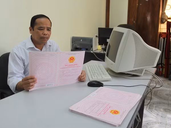 Yêu cầu các địa phương đẩy nhanh tiến độ cấp đổi sổ đỏ ảnh 1