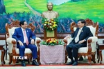Thủ tướng Phạm Minh Chính hội kiến Tổng Bí thư, Chủ tịch nước Lào Thongloun Sisoulith. (Ảnh: Dương Giang/TTXVN)