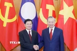 Tổng Bí thư Tô Lâm hội đàm với Tổng Bí thư, Chủ tịch nước Lào Thongloun Sisoulith. (Ảnh: Thống Nhất/ TTXVN)