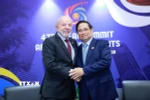 Thủ tướng Phạm Minh Chính gặp Tổng thống Brazil Lula da Silva. (Ảnh: Dương Giang/TTXVN)