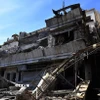 Tòa nhà bị trúng không kích của Israel tại Damascus, Syria. (Ảnh: THX/TTXVN)