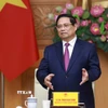 Thủ tướng Phạm Minh Chính tiếp đoàn lãnh đạo doanh nghiệp bán dẫn quốc tế. (Ảnh: Dương Giang/TTXVN)