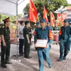 Các thành viên tổ công tác thực hiện nghiêm ngặt quy trình kỹ thuật, niêm phong và lập mã định danh cho các mẫu hài cốt liệt sỹ phục vụ xây dựng cơ sở dữ liệu gene. (Ảnh: TTXVN phát)