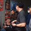Đối tượng bị bắt giữ sau 2 giờ gây án. (Ảnh: TTXVN phát)