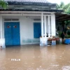 Nước lũ gây ngập nhiều nhà dân ở thôn Hội Nhơn, xã Hàm Liêm. (Ảnh: Hồng Hiếu/TTXVN)