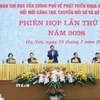 Thứ trưởng Bộ Công an Nguyễn Văn Long báo cáo kết quả triển khai Đề án 06. (Ảnh: Dương Giang/TTXVN)