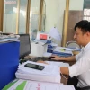 Cán bộ xã Đông Mỹ (thành phố Thái Bình) chuẩn bị cho việc vận hành thử nghiệm bộ máy chính quyền phường Trà Lý mới. (Ảnh: Thu Hoài/TTXVN)